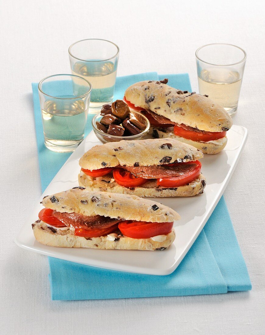 Olive rolls with tomatoes and anchovies