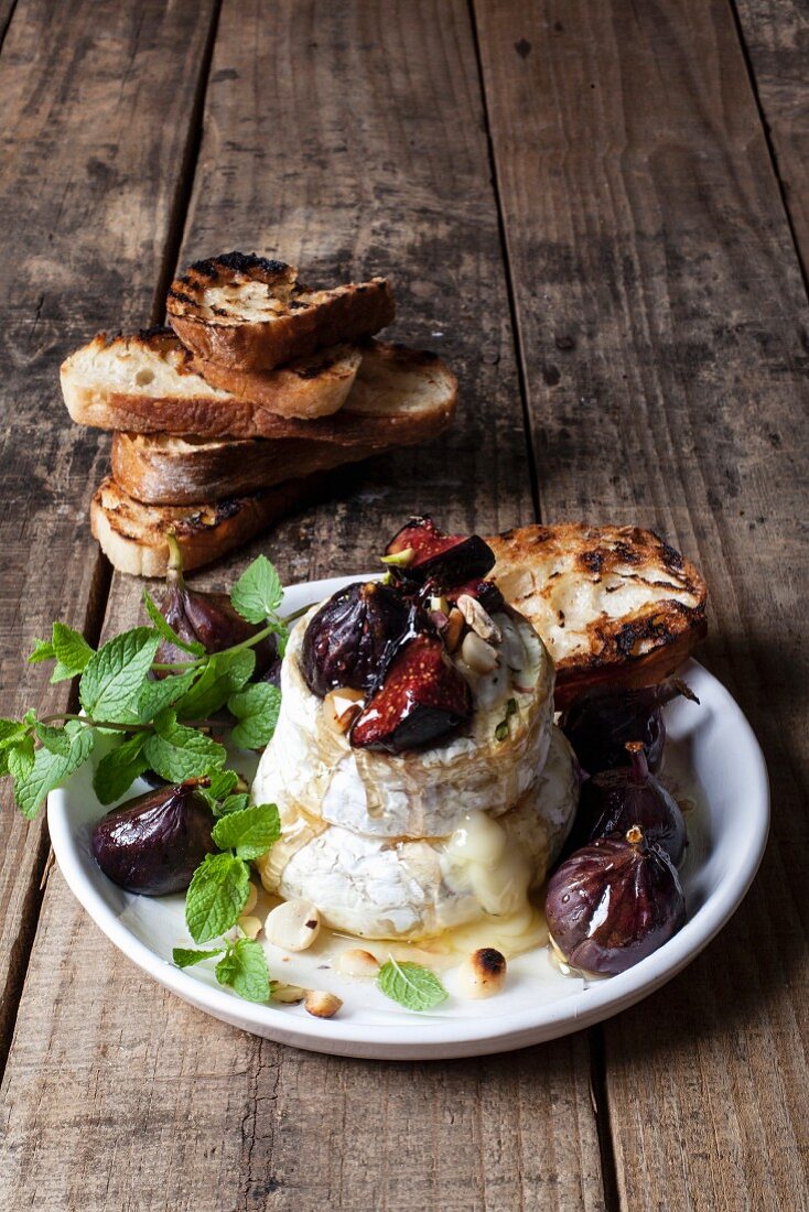 Camembert with poached figs, macadamia-nut brittle and fynbos honey