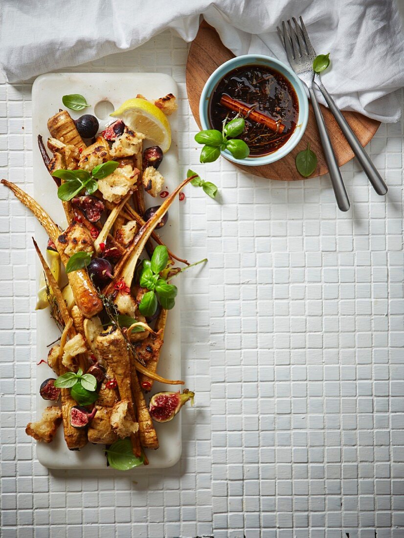 A salad of fried parsnips with fresh figs, croutons, chilli, lemon, and a spicy sherry sauce