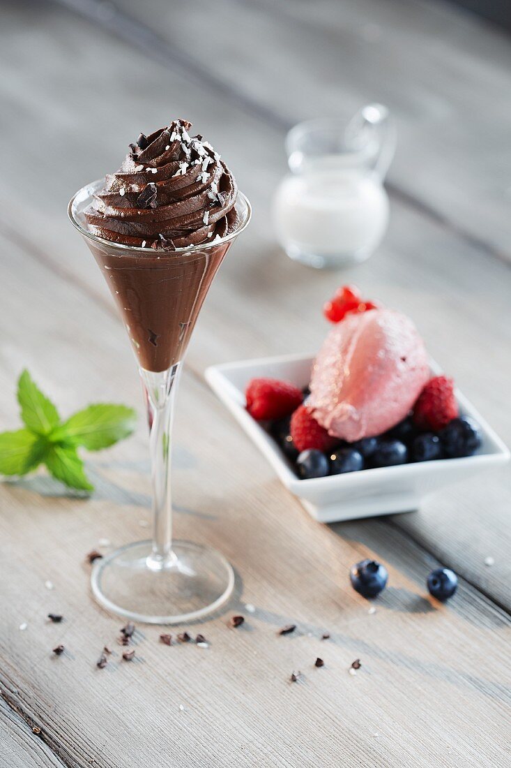 Mousse au chocolat and strawberry mousse with berries