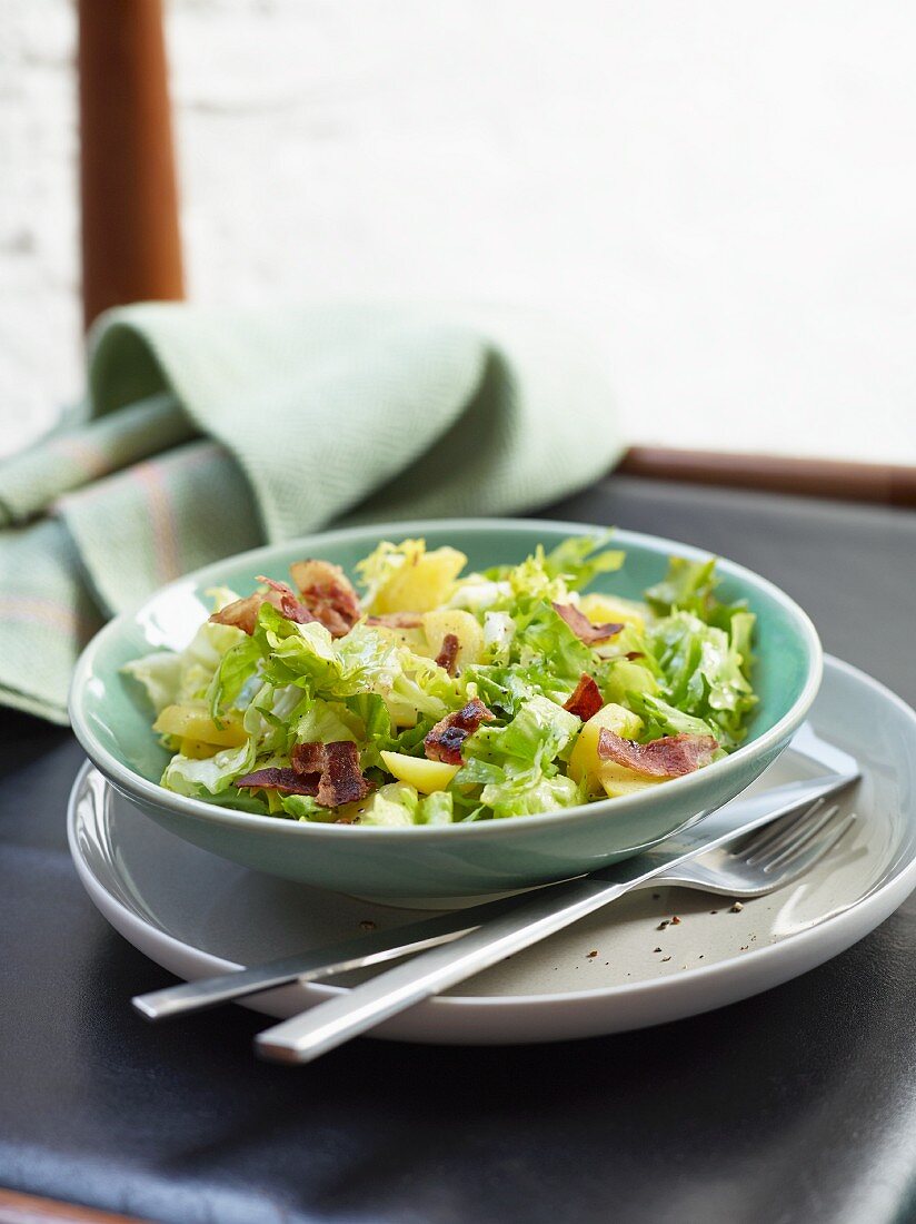 A rustic chicory salad with bacon