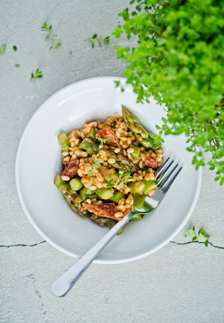 Pearl barley with green asparagus and dried tomatoes