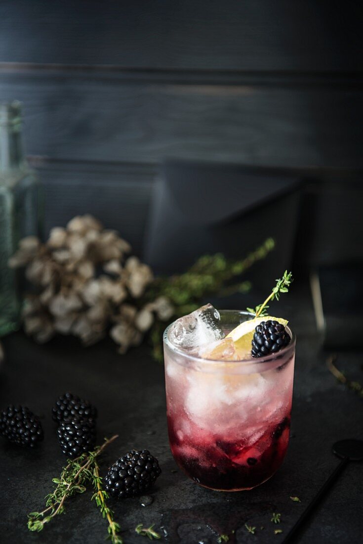 Bramble cocktail made with gin, blackberry liqueur and lemon