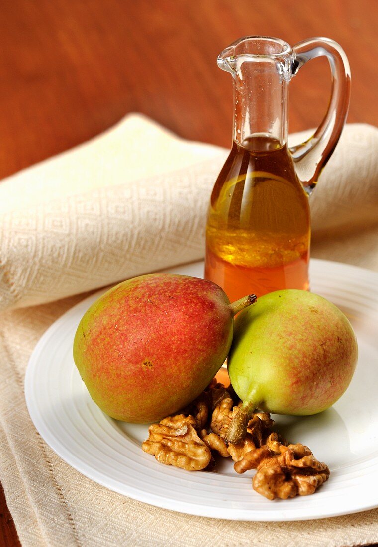 An arrangement of pears, nuts and liqueur