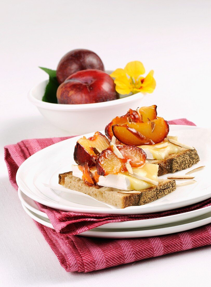 Bread topped with Brie and plums