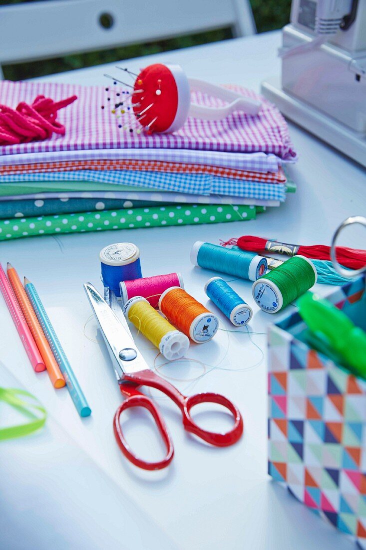 Various sewing utensils on a table outdoors