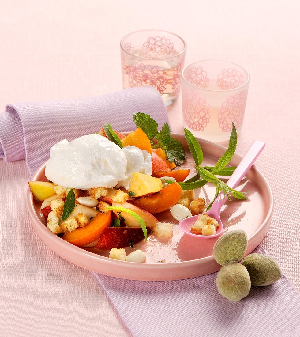 Fruit salad with lemon sorbet, white almonds and croutons