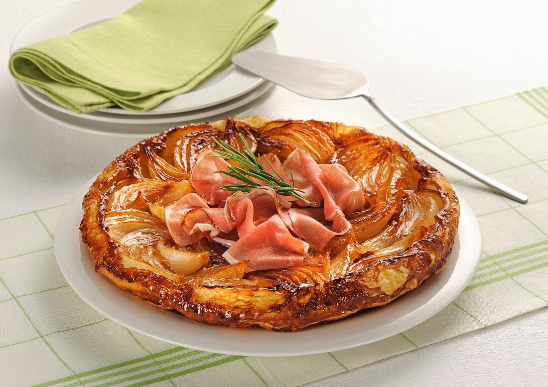 Onion tarte tatin with raw ham