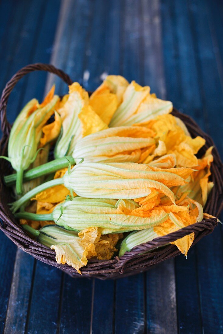 Fresh courgette flowers in a basket