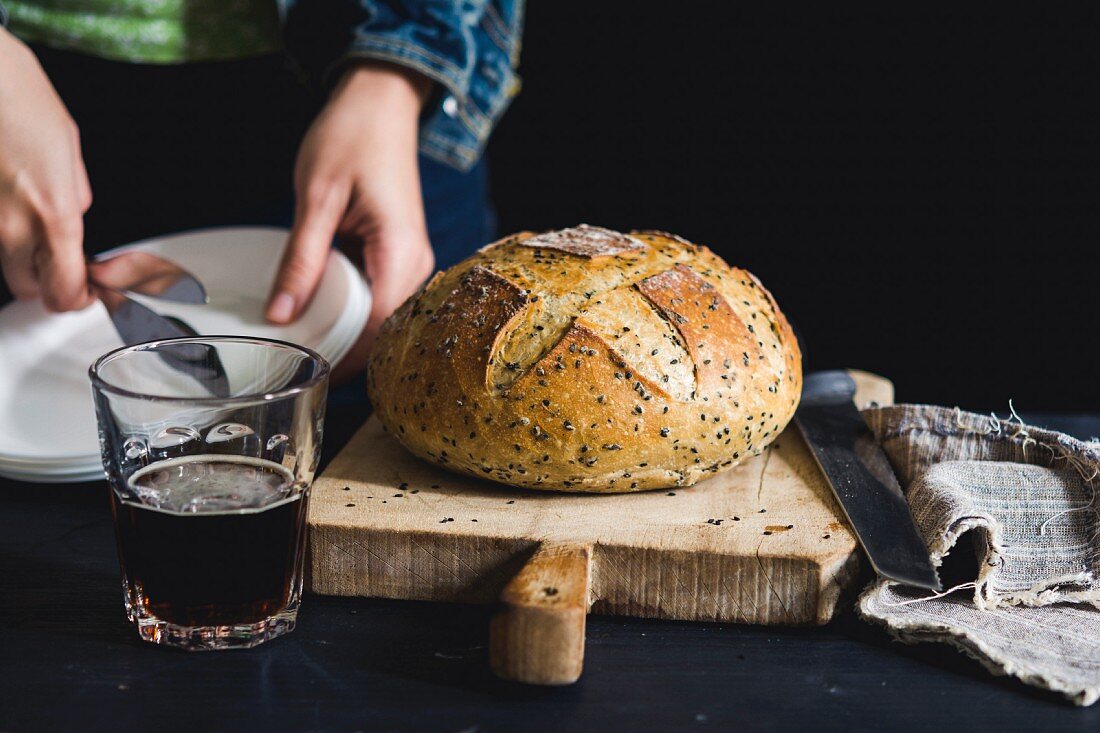 A loaf of country bread and beer