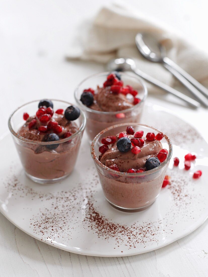 Bowls of chocolate mousse with fruit