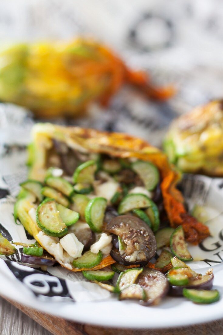 Stuffed courgette flowers with aubergines, courgette and feta cheese