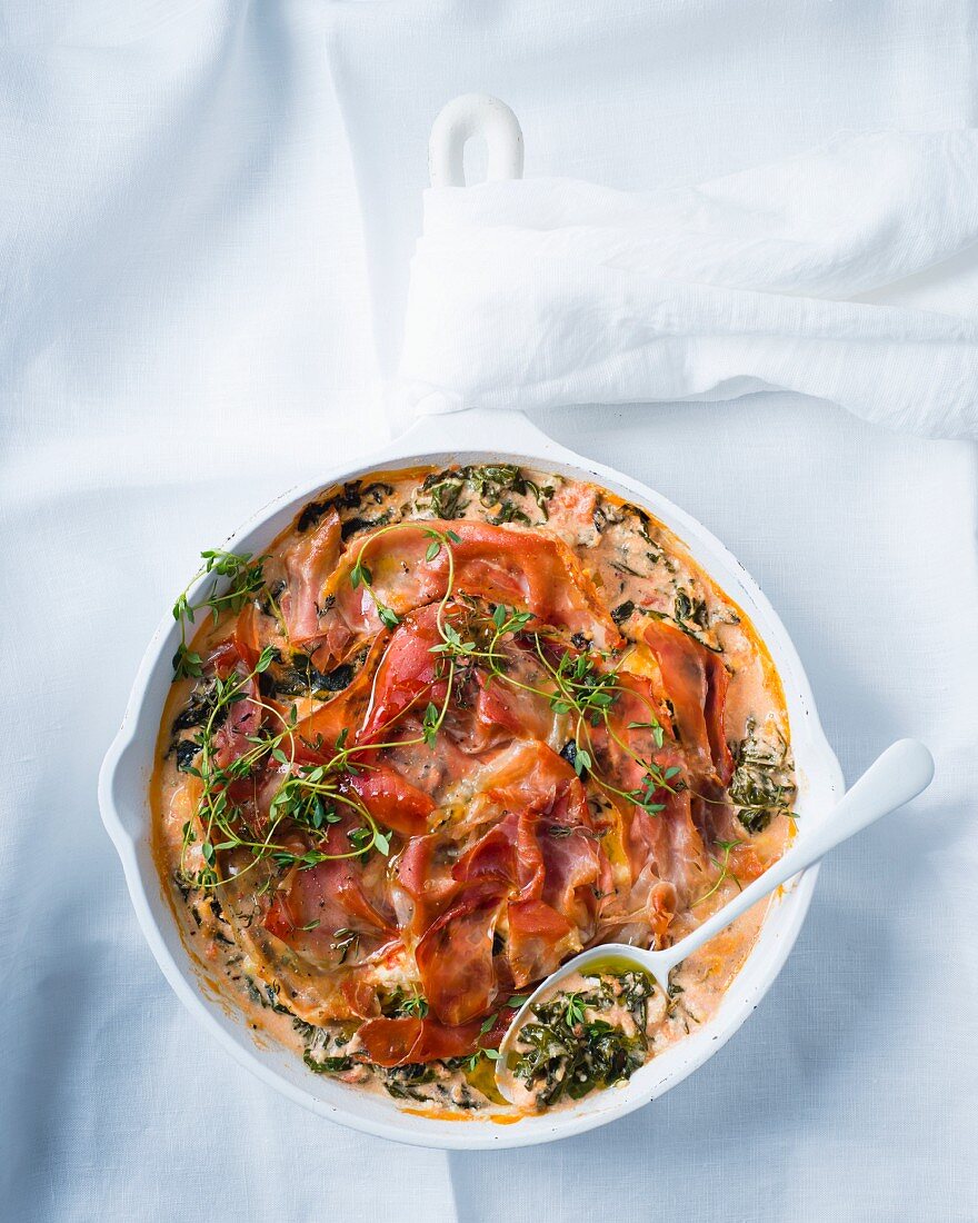 Spinach bake with cheese and Prosciutto