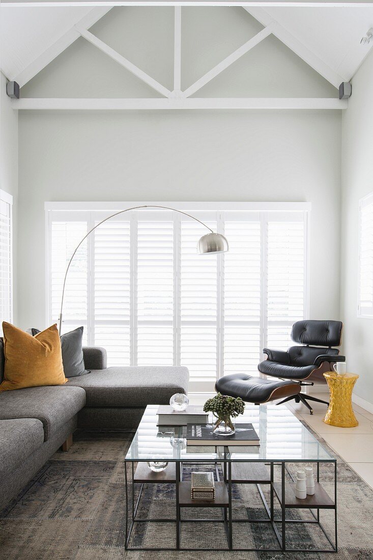 Contemporary living room with exposed roof structure