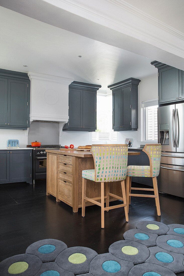 Wooden island counter in American-style kitchen