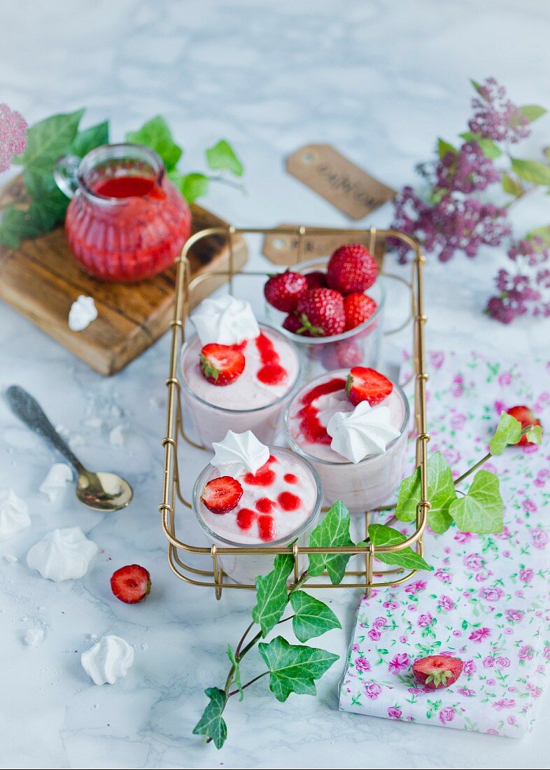 Strawberry mousse with meringues in an old-fashioned metal stand