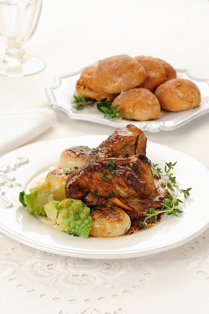 Roast lamb with onions and Romanesco broccoli