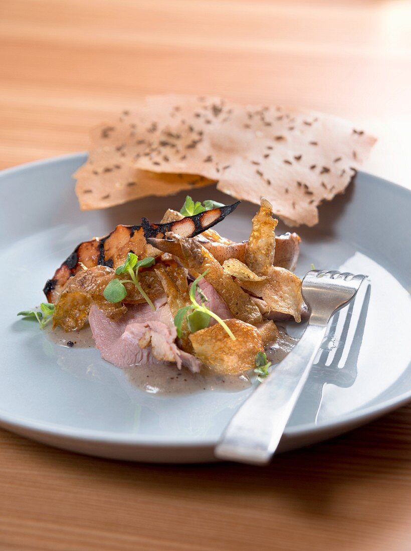 Smoked duck breast with crispy skin and caraway bread