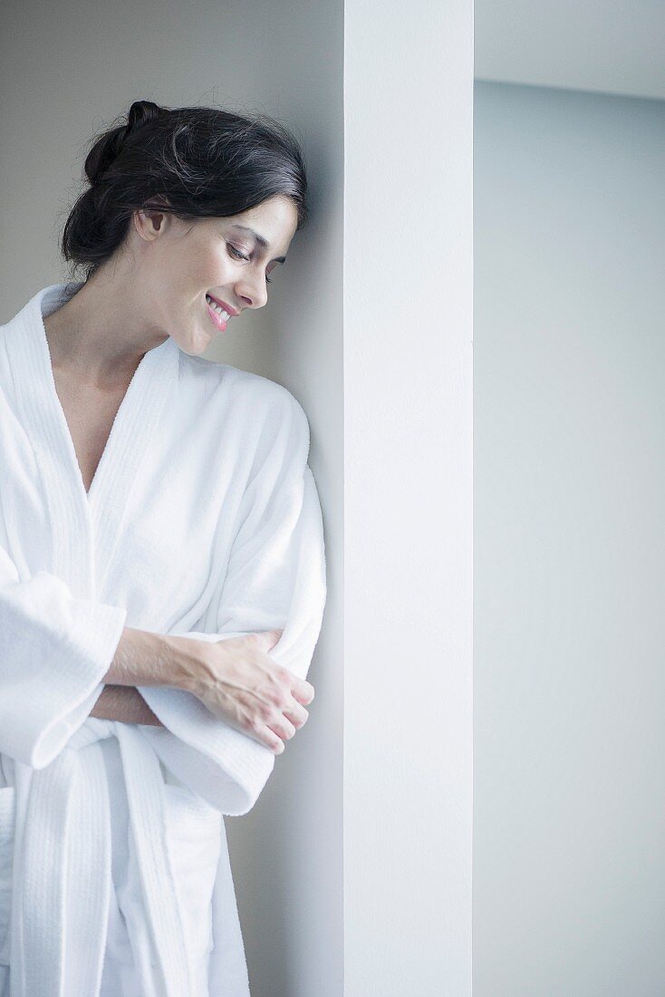 Woman relaxing in bathrobe