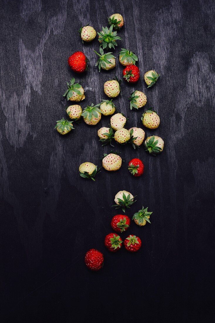 Strawberries on a black surface