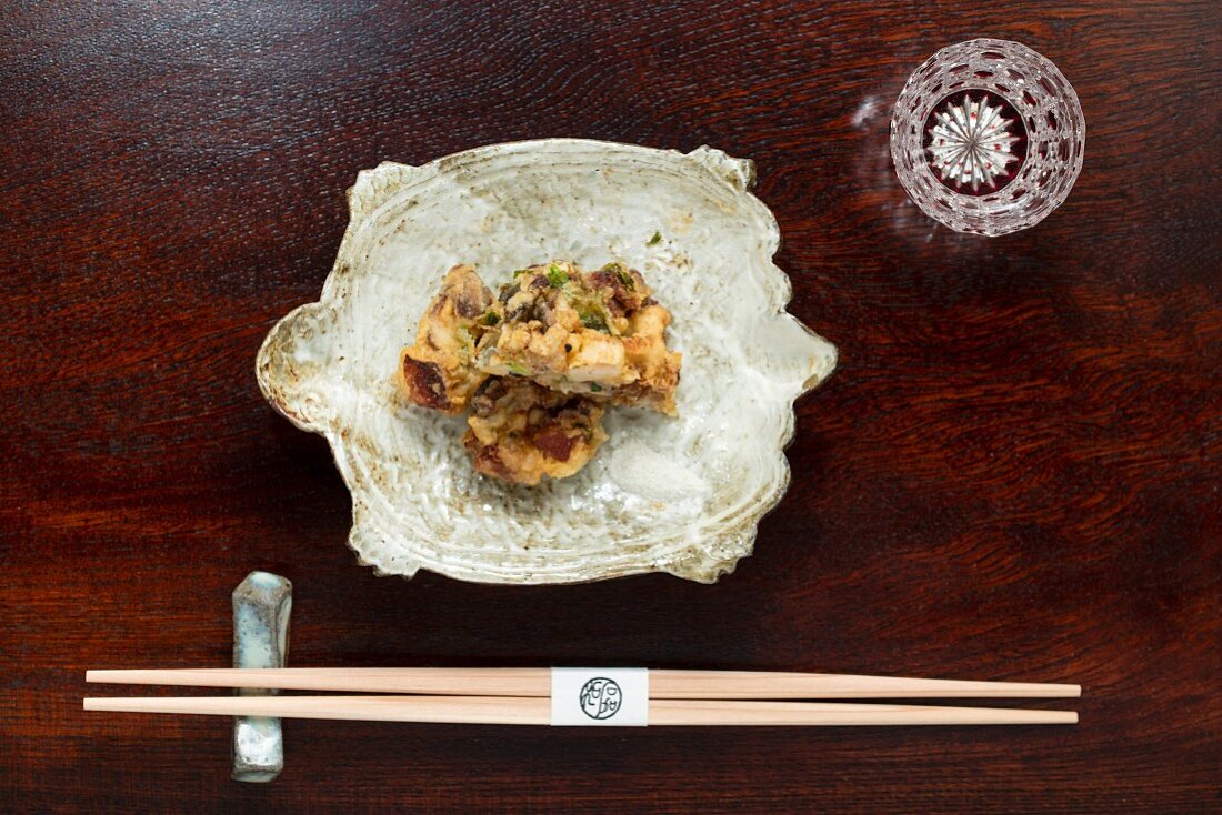 Kaiseki menu: Chinese soft turtle in a bowl with chopsticks
