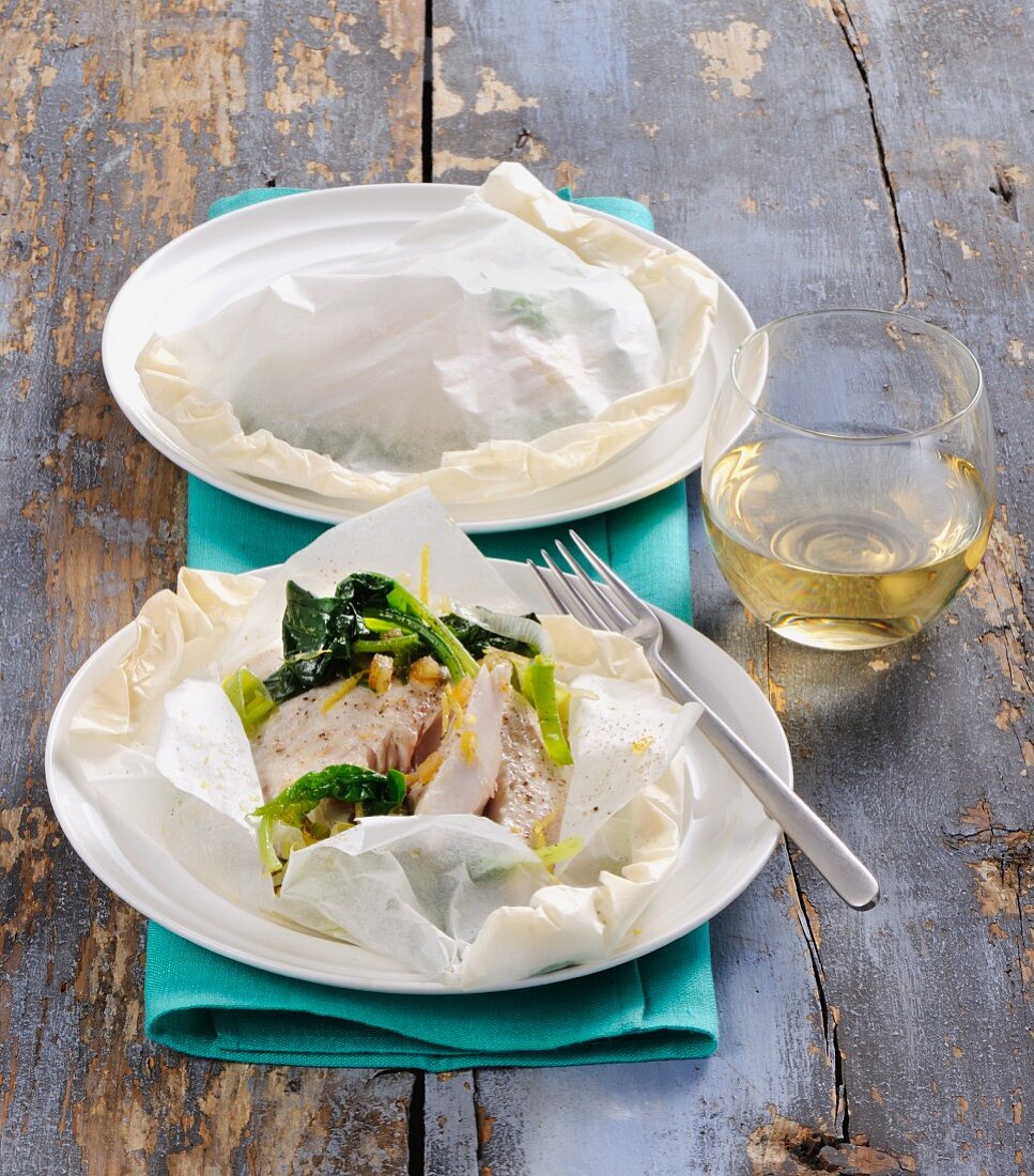 Fish with vegetables in parchment paper