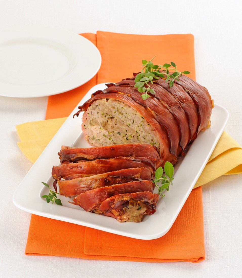 Meatloaf with mushrooms wrapped in ham