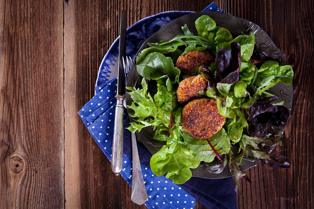 Quinoa fritters on a bed of lettuce