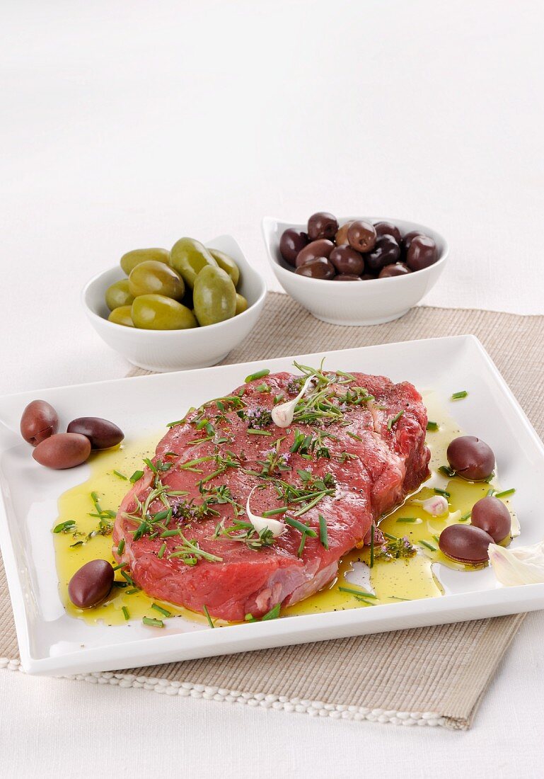 Raw, marinated beef steak