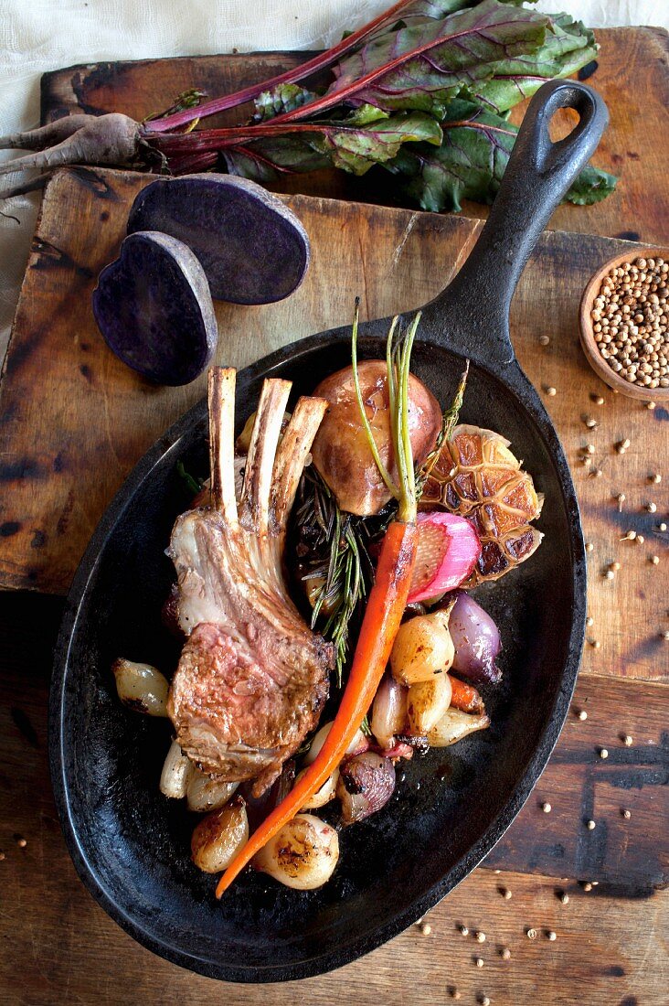 Pork chops and vegetables in a frying pan