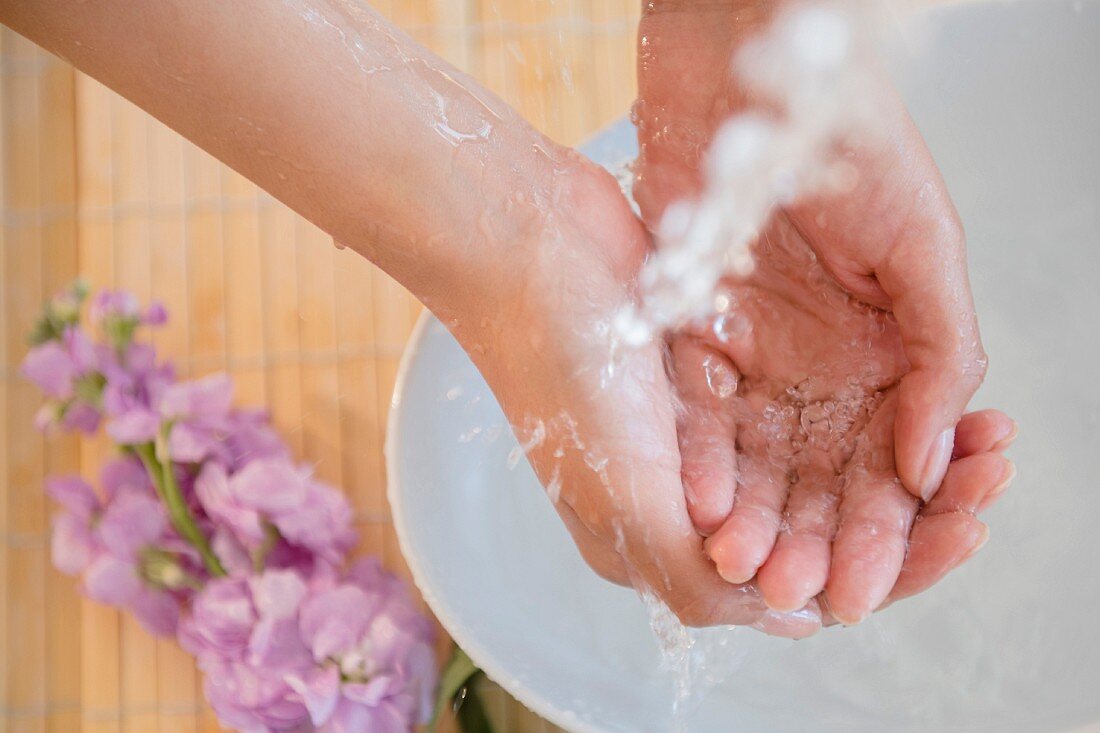 A woman washing her hands