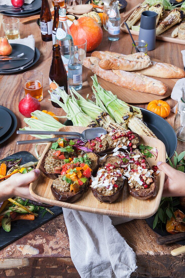 Roasted stuffed aubergines with lentil and coconut curry