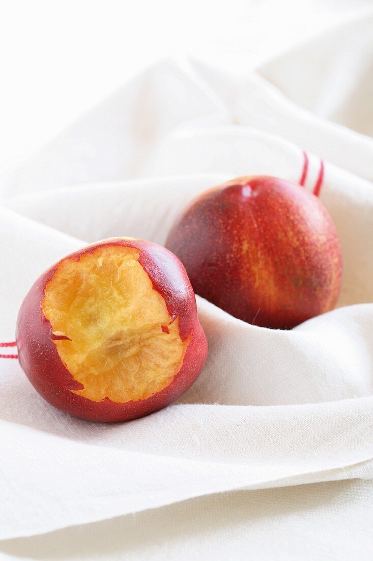 Nectarines, one with a bite taken out