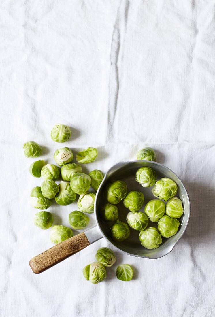 Brussels sprouts in a bowl and next to it
