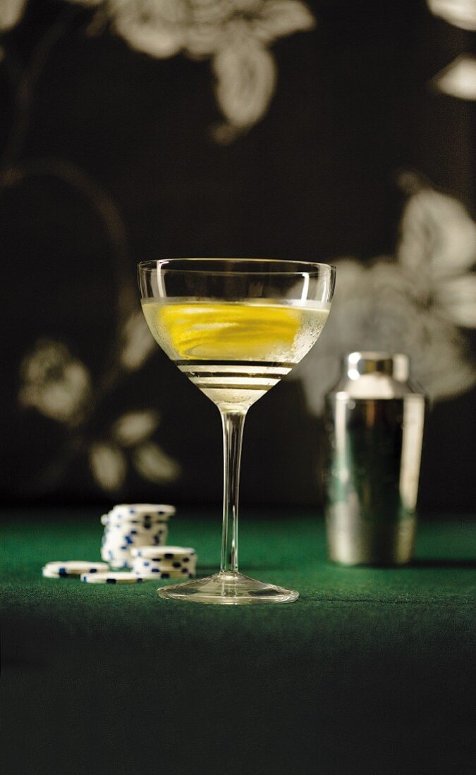 Vesper Martini made with gin, vodka and Kina Lillet on a casino table