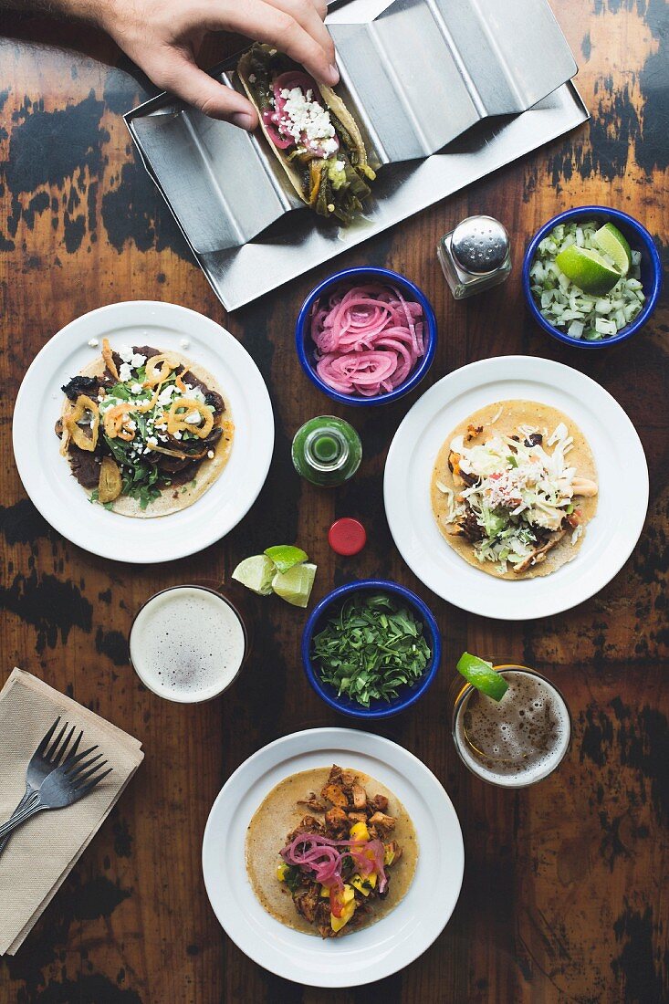 A person making tacos (seen from above)