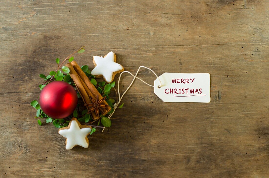 Christmas decorations with cinnamon sticks, cinnamon stars and a Christmas bauble