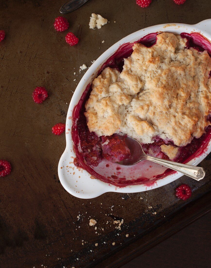 Cobbler with wild raspberries in a baking dish