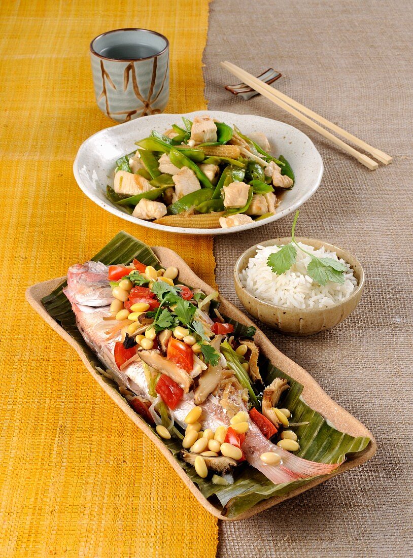 Steamed pandora in a banana leaf, and stir-fried chicken with vegetables