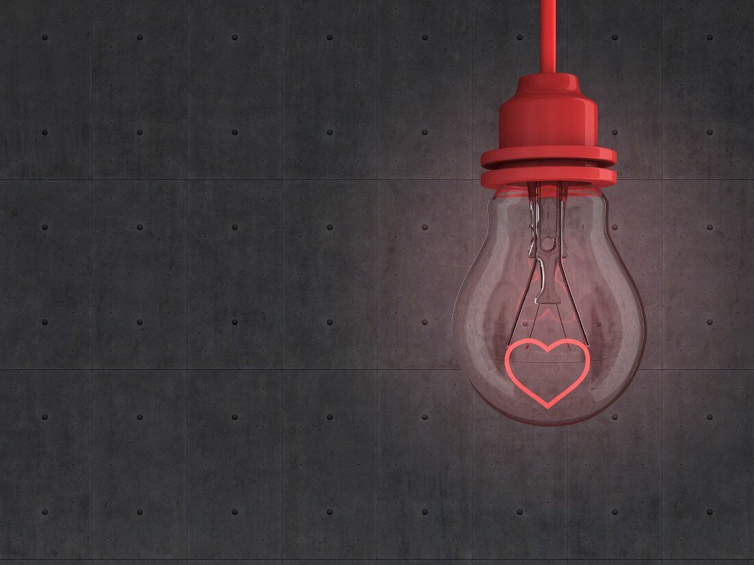 Light bulb with red heart-shaped filament in front of concrete wall - 3D rendering