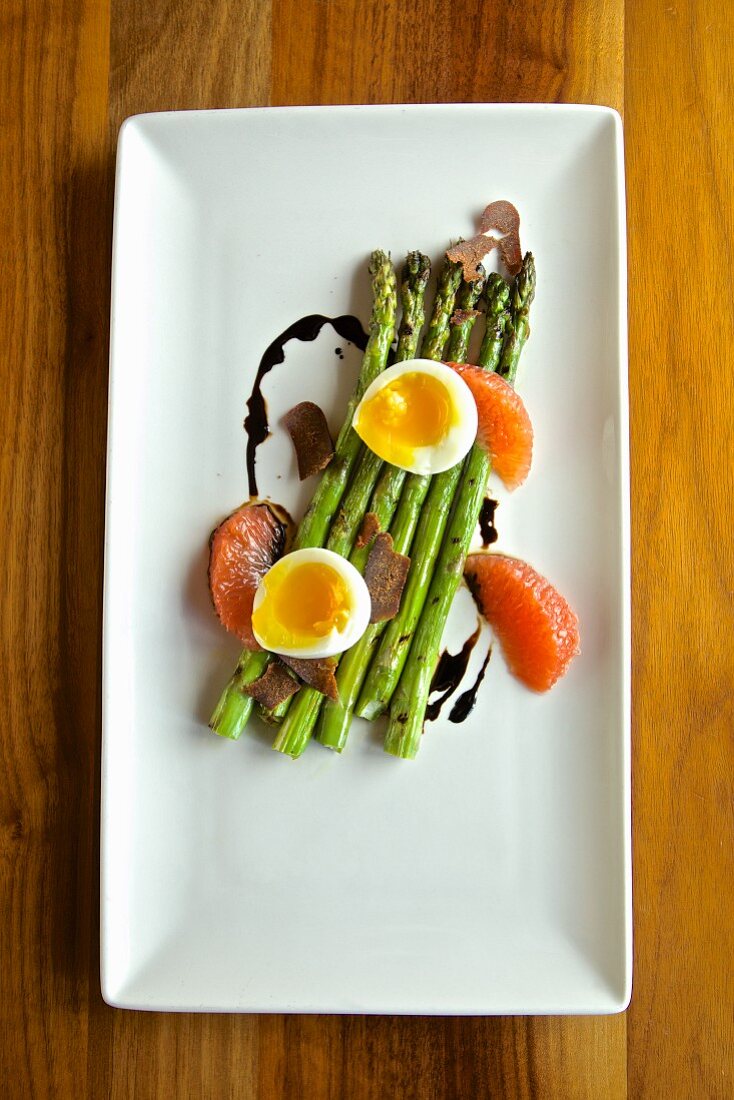 Green asparagus with soft boiled egg, blood oranges, truffles and balsamic vinegar