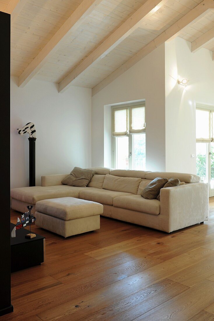 Attic living room with exposed beams