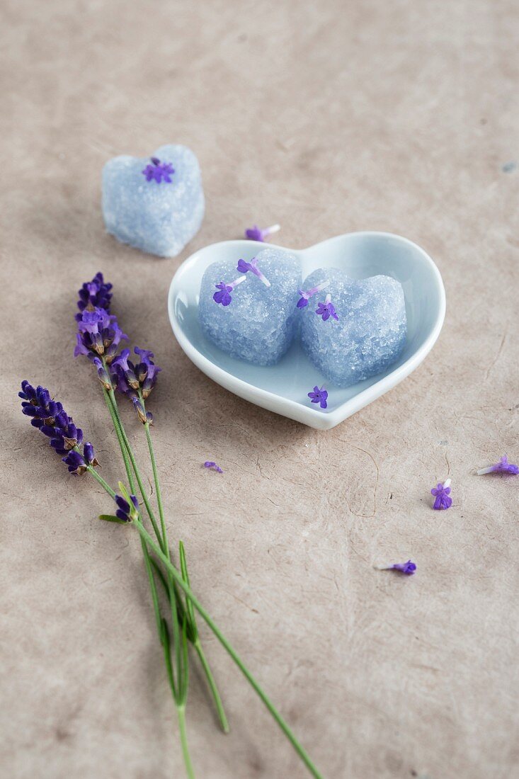 Homemade heart-shaped lavender sugar in a heart-shaped dish