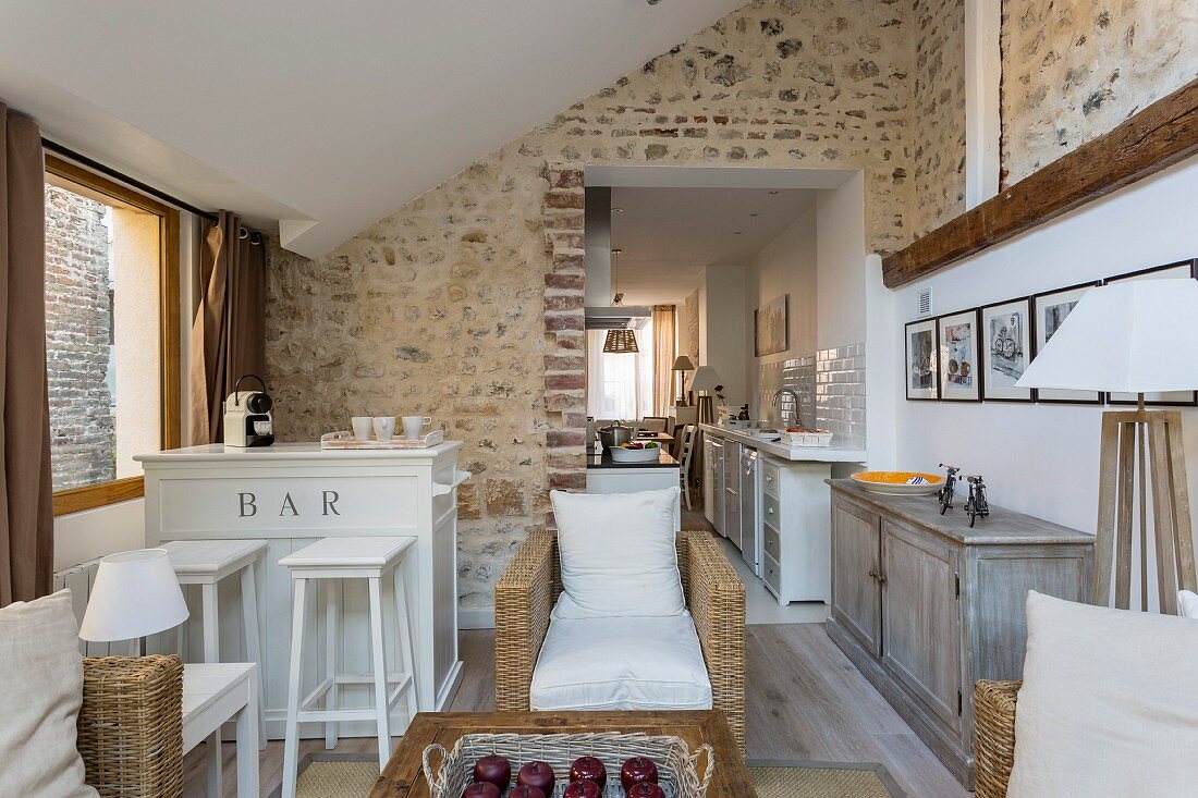 Exposed masonry in open-plan living area of renovated townhouse