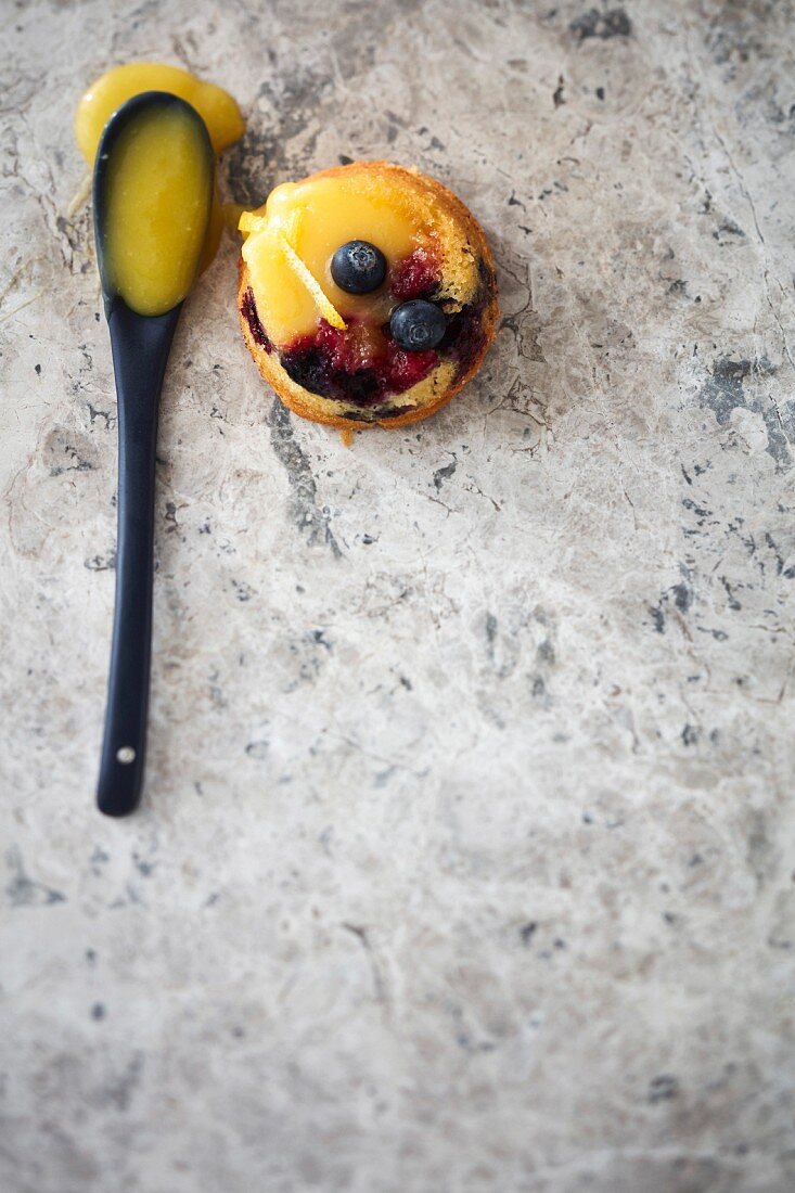 A berry muffin filled with lemon curd