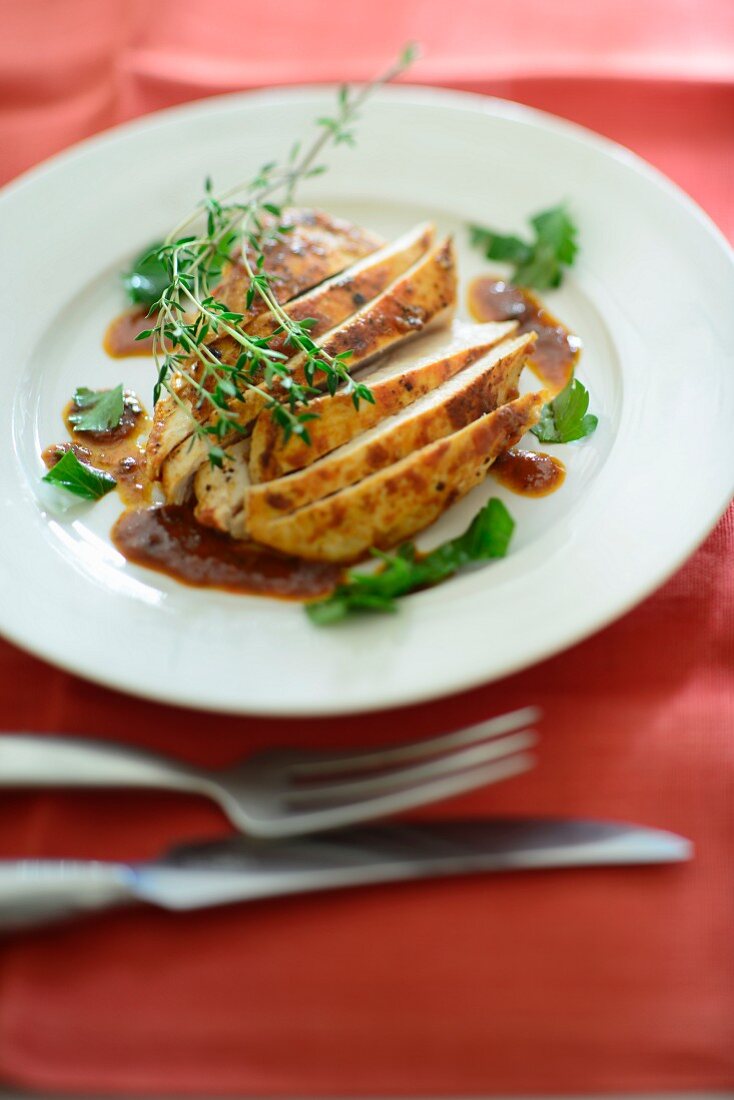 Chicken breast with a spicy sauce and herbs