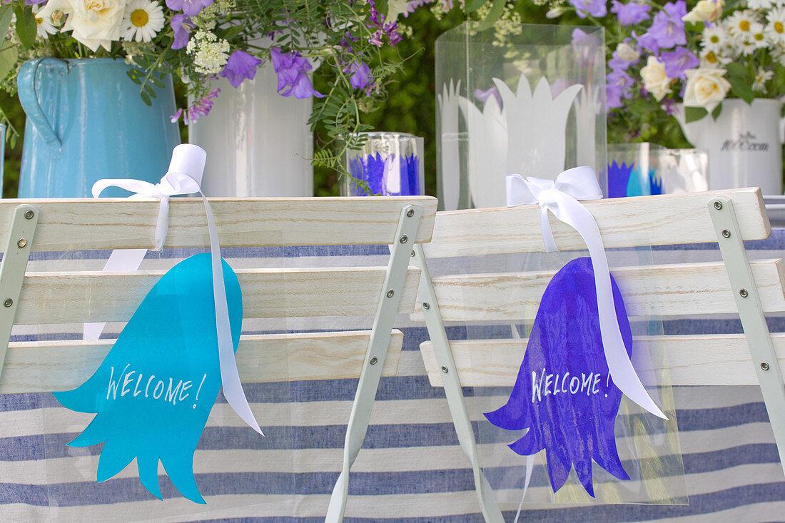Laminated tags with paper bellflower silhouettes on garden table