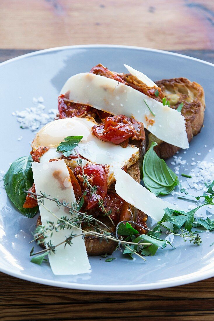 Shakshuka on ciabatta with tomatoes, chilli and Parmesan cheese