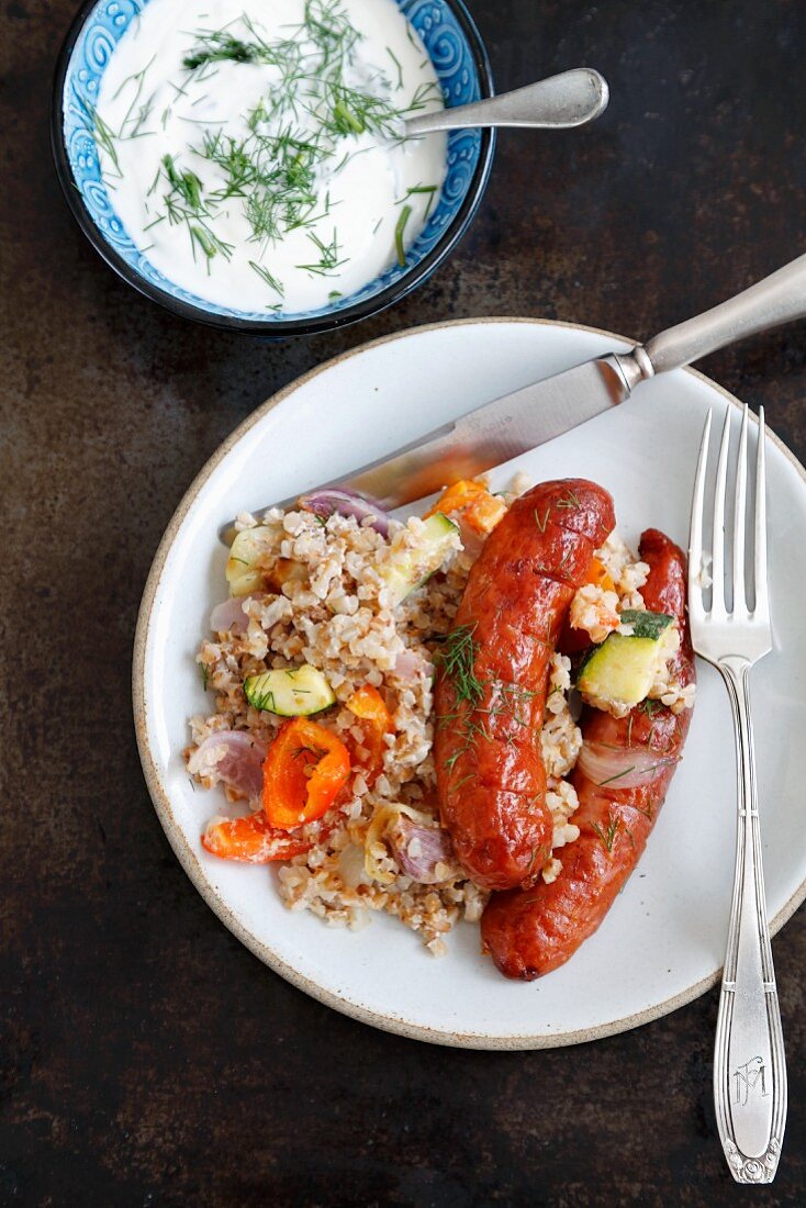 Buckwheat and vegetable bake with sausages