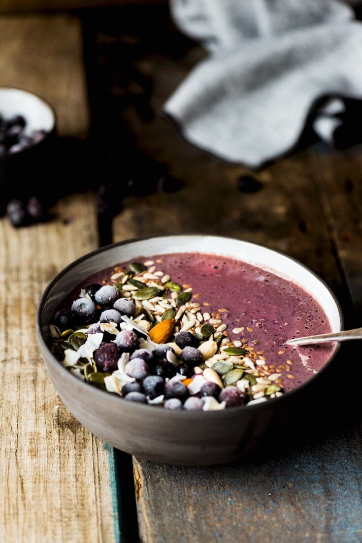 A smoothie bowl with quinoa and blueberries